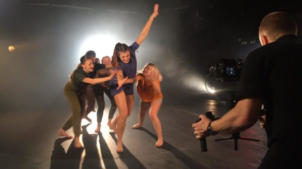ICTheatre students dancing on set in front of a camera