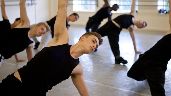 Jazz Northern Ballet students in class stretching