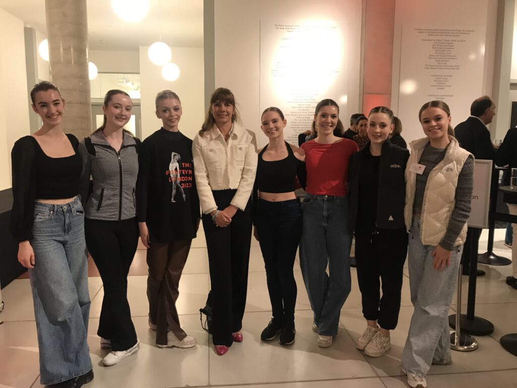Northern Ballet School participants in the 2023 Fonteyn International Ballet Competition pose together out of costume with Dame Darcey Bussell